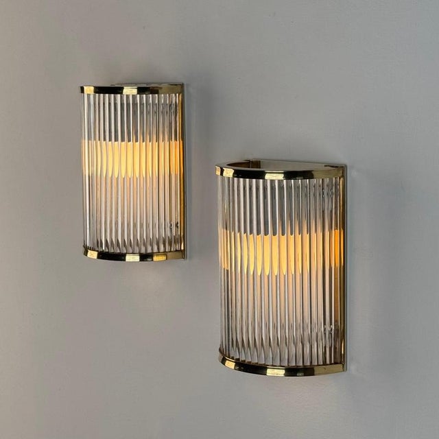 A refined pair of murano glass and polished brass wall sconces by de majo, venice, produced in the 1970s. Elegant and...