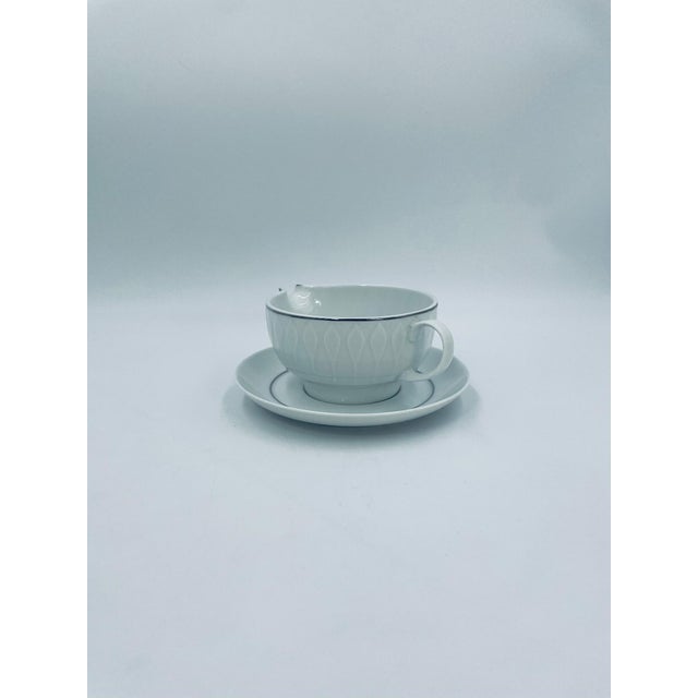 A sauceboat with saucer from the renowned Thomas Germany manufacturer, part of the prestigious Rosenthal Group, from the...