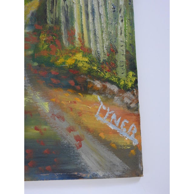 Mid 20th century oil on canvas board painting of a forest road lined with trees in autumn colors. Signed Tyner lower right...
