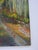 Mid 20th century oil on canvas board painting of a forest road lined with trees in autumn colors. Signed Tyner lower right...