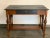 A late 19th century library desk table with an ebonized oak top and drawer. The caned sides are handcrafted and in...