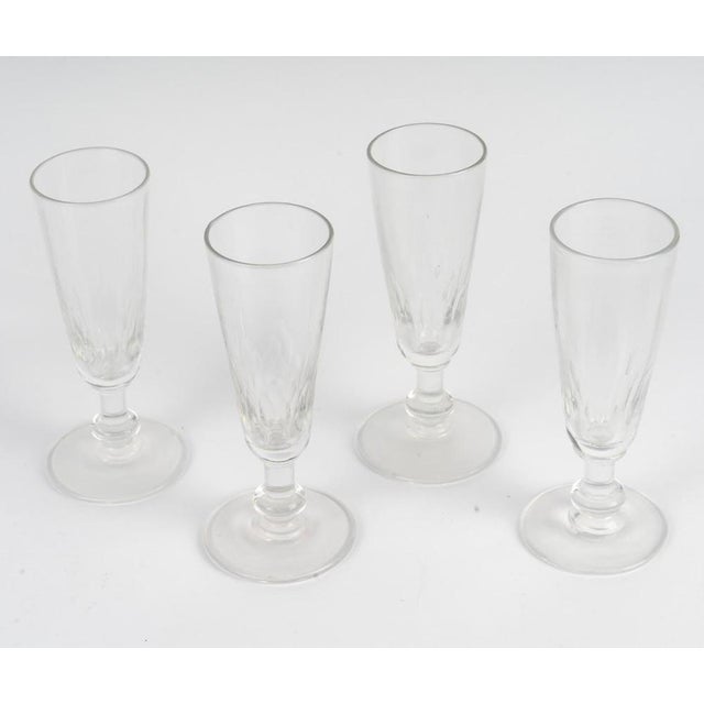 Suite of 4 Champagne glasses, XXth century. Suite of 4 Champagne glasses, XXth century. H: 15cm, D: 5cm.