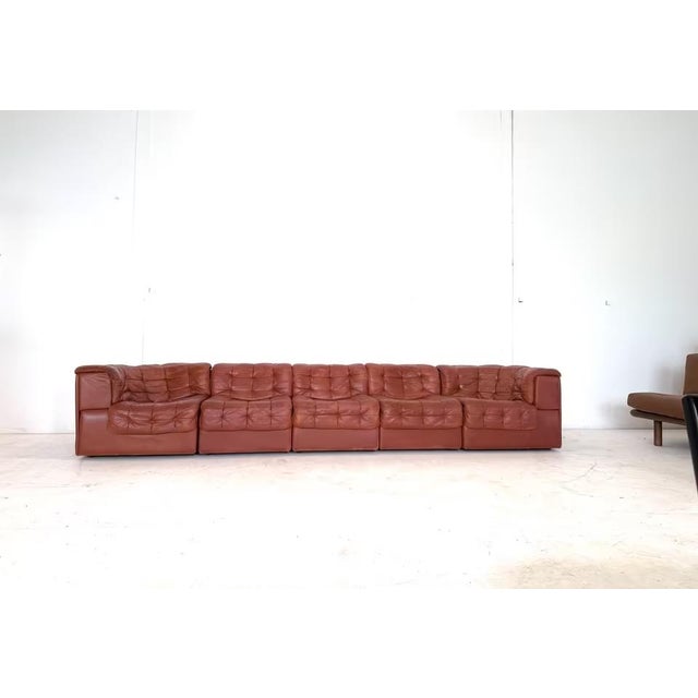 Manufacturer: de Sede Designer: de Sede Design Team Model: DS 11 Upholstery: Nappa leather Color: Brown Dimensions: 3...