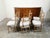 A set of six French wooden dining room chairs from the 19th century, with four sides, two arms, carved guilloche motifs...