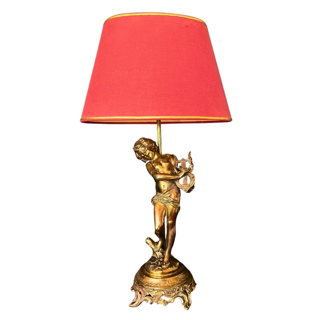 An enchanting 19th century French gilt bronze lamp sculpture entitled “The Lyre Player” by Auguste Moreau. It features a...