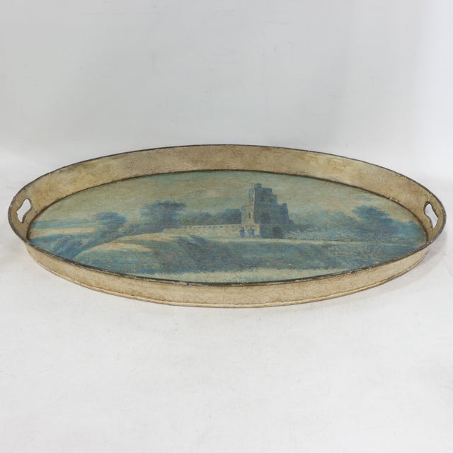 This atmospheric vintage oval tole tray features a serene, hand-painted landscape rendered in a soft palette of muted...
