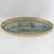 This atmospheric vintage oval tole tray features a serene, hand-painted landscape rendered in a soft palette of muted...