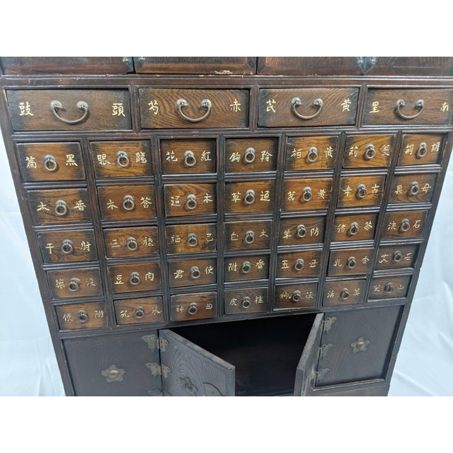 Purchased in Korea and subsequently brought to the United States, this remarkable Korean yakjang herbal apothecary cabinet...