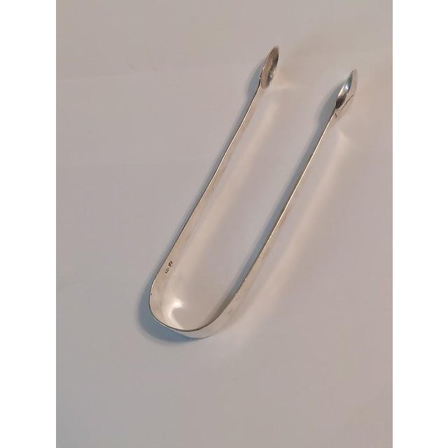 Antique George III English sterling silver sugar tongs, dating to the late 18th century and probably made by Joseph Hicks...