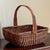 A charming little woven wicker garden trug-style basket featuring a deep, gently rounded body with pretty French randing,...