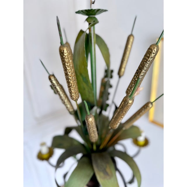 French painted tole botanical chandelier, circa 1965–1975, sculptural design of cattails, flowers, and foliage. Hand-...