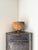A raw industrial cabinet in fabricated steel with riveted details and turn button closures. This patinated metal corner...