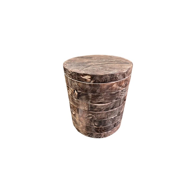 A wonderfully sculptural round side table.The tables neutral pigment and subtle wood texture makes it perfect for any...