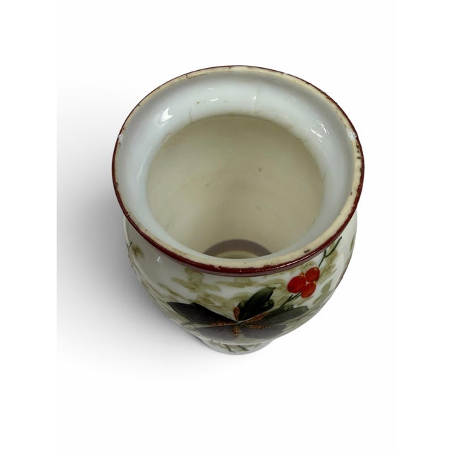 An exceptional and highly unique pair of antique Japanese Kutani porcelain mantle vases dating to the Meiji period...