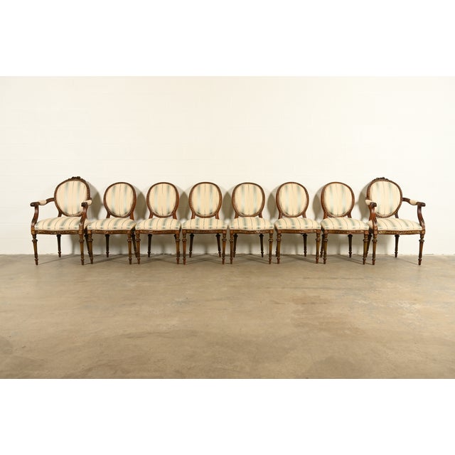 A gorgeous set of eight French Regency Louis XVI style dining chairs In the manner of Karges Furniture USA, Circa 1960s...