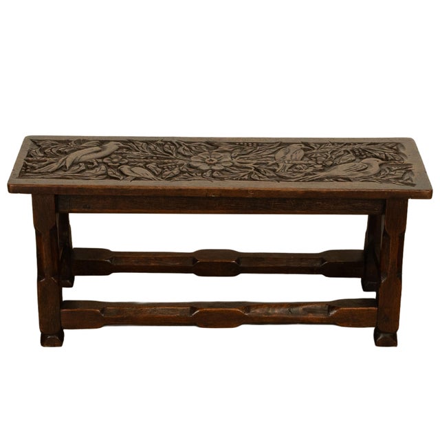 An unusual and attractive antique carved oak Arts and Crafts bench, circa 1900. This very handsome antique bench has a...