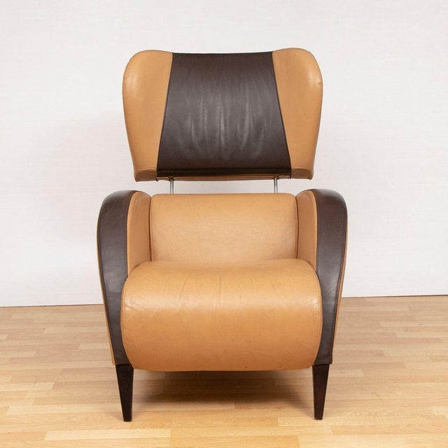 H: 93cm w: 76cm d: 98cm seat height: 41cm a midcentury 'grassoler' spanish armchair upholstered in tan and brown leather...