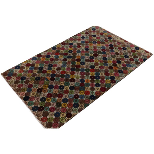 Hand-knotted in wool circa 1960-1970, this vintage 6x9 mid-century rug joins from the Mid-Century Pasha Collection by Rug...
