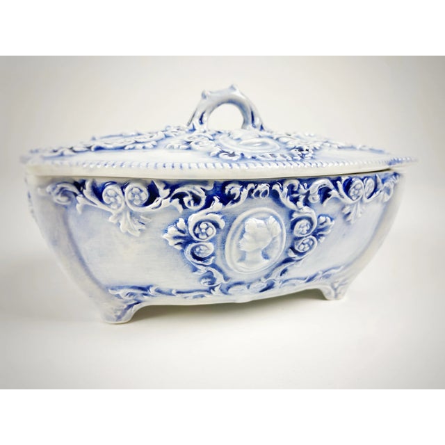 Beautiful ceramic dish with lid, features cobalt blue and white victorian inspired silhouettes of women's faces. Small...