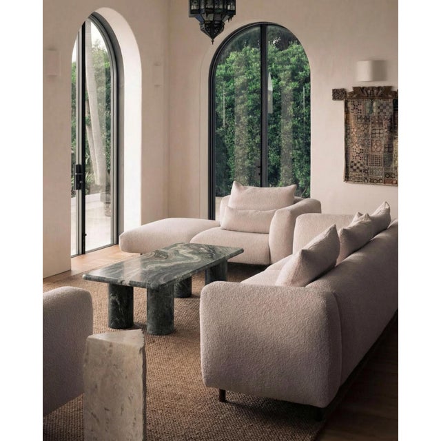 This minimalist Green marble coffee table is made from one material, featuring a curved edge top in green marble with...