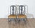 This fine pair of 19th-century Swedish Rococo chairs blends sculptural elegance with a bold, moody palette. Painted in a...