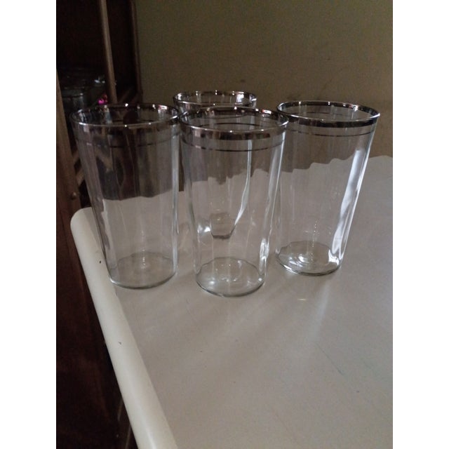 1936) Beautiful set of four rare 1936 Philco Radio Bar glasses, each standing 5" tall with a classic silver‑rimmed edge....