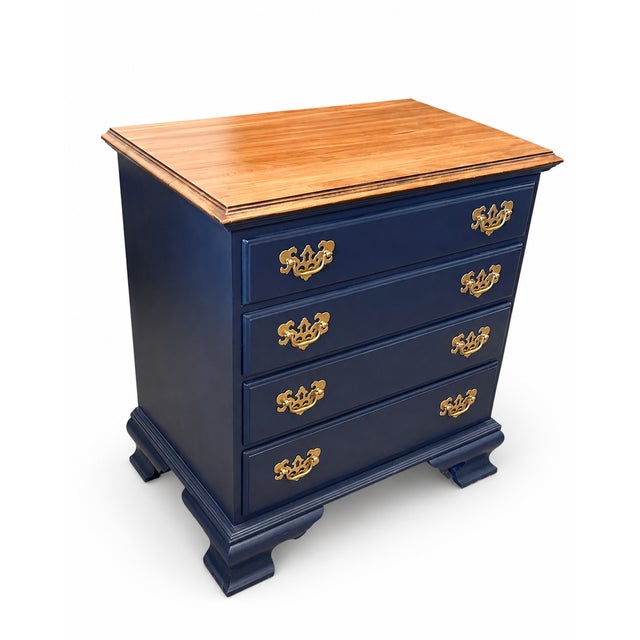 A classic Ethan Allen four-drawer chest reimagined with a sophisticated navy blue painted finish and warm wood top....