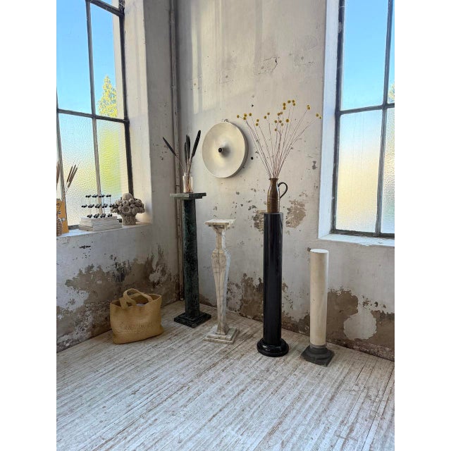 Set of four marble columns of varying sizes and shapes. these columns can be displayed as is, either as decorative pieces...