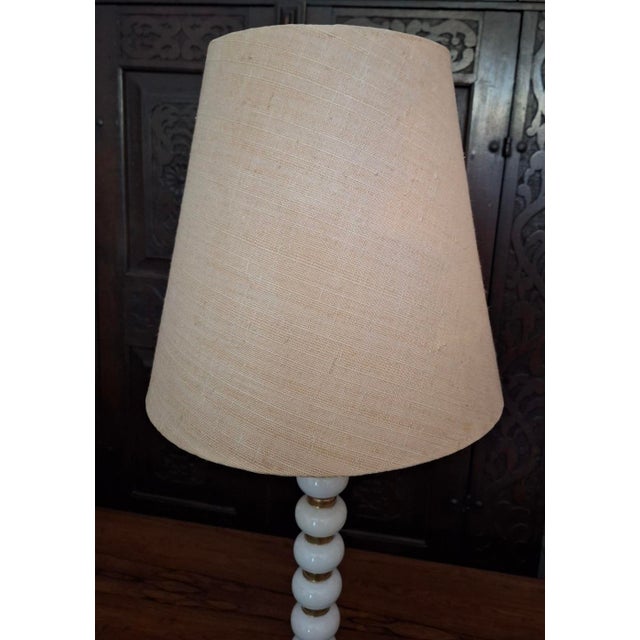 Tall and elegant high quality mid-century Italian table or desk lamp with stacked porcelain spheres separated by gold-...