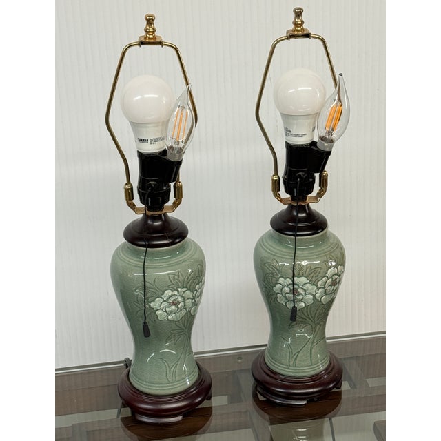 Design Plus Gallery presents a Pair of Jade Glazed Table Lamp from the Mid 20th Century. They have an asian influence as...