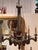 Carved and painted wood chandelier with a fluted column rising from acanthus leaves, over scrolled arms holding candle...