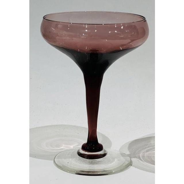 Sweet pair of hand blown amethyst coupe glasses. The photos don't really do them justice. Ready for a champaign cocktail!