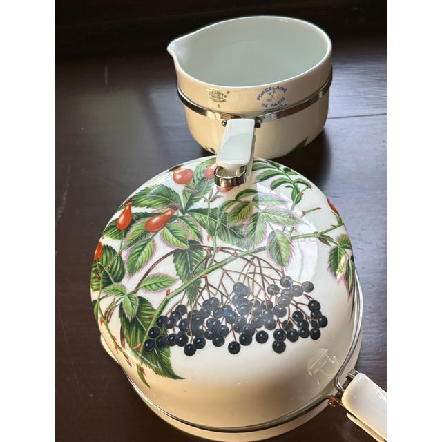 Bring timeless French country charm to your kitchen with this delightful set of four vintage porcelain-clad aluminum pots...