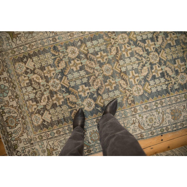 :: Allover covered field in a Herati design motif with abrashes across and birds perched hidden throughout. Main border in...