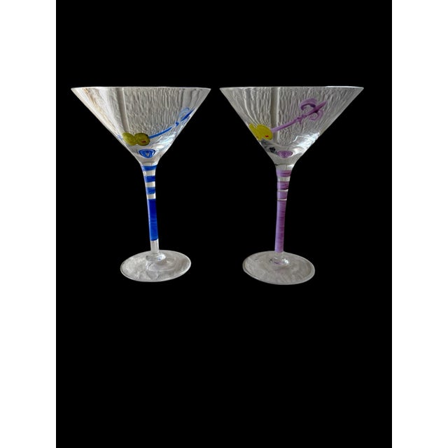 Add a playful touch to cocktail hour with this pair of hand-painted martini glasses. Each clear glass features two green...