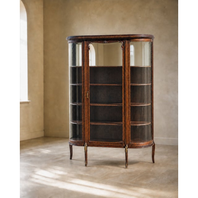 Edwardian Curved Glass Demi-Lune Display Cabinet. An elegant early-20th-century oak display cabinet with a shallow demi-...
