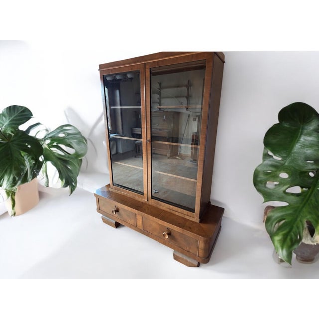 Beautiful Art Deco piece from Germany around the 1930s. This showcase is characterized by its high-quality workmanship,...