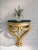 Handcrafted in Italy, this wall-mounted console table features an intricately hand-carved frame finished in 24-karat...