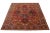 This beautiful antique Heriz hand-knotted wool rug features a red field. The Persian rug highlights a center medallion...