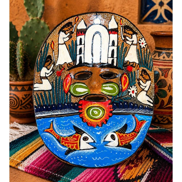 A wonderfully graphic vintage Mexican folk-art wall mask, hand formed from warm reddish terracotta/earthenware clay and...