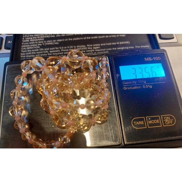 Vintage Swarovski crystal necklace with pink topaz, circa 1960. This necklace features clear, graduated pink crystal beads...