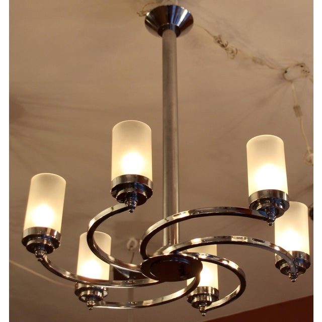 Rare ceiling light with six spiral arms with etched glass tubes in top condition! The old glass cylinders have different...