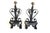 A pair of hand-forged wrought iron andirons. Expertly crafted with classic scrollwork, heart-shaped details, and elegant...