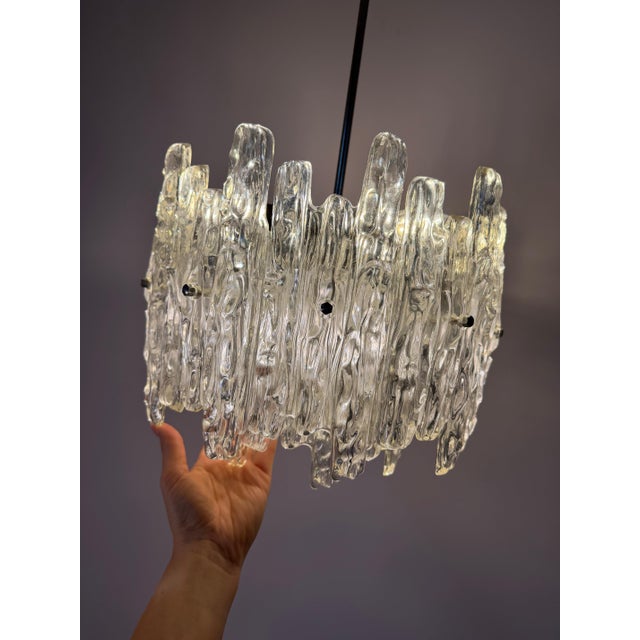 A fascinating classic of east german modernism: this expansive ice-glass chandelier from veb narva perfectly captures the...