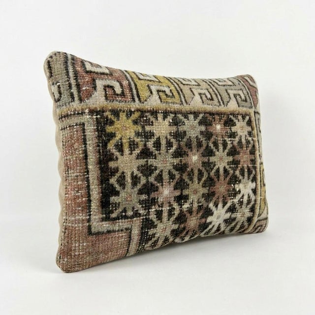 This beautiful 16'' X 24'' pillow cover was made from an authentic Turkish rug. Bright colors of wool adorn the front of...