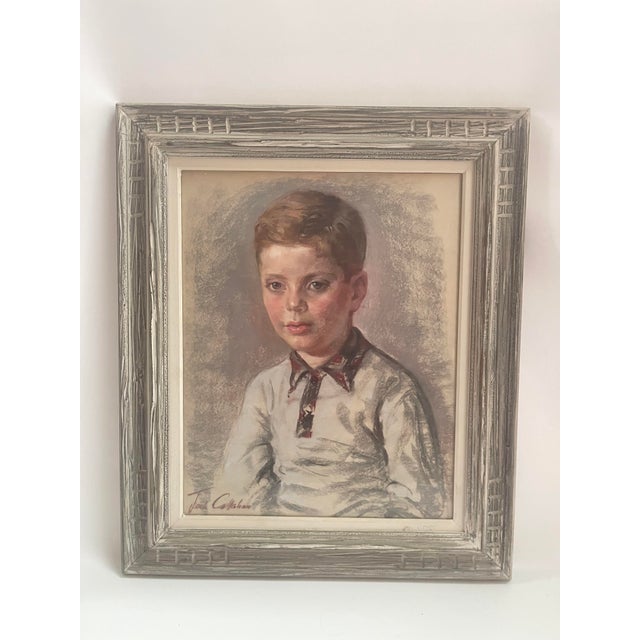 Original charcoal painting of young boy displayed in original carved wood painting under glass. Signed lower left.