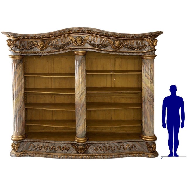 A truly impressive and monumental French bibliothèque (library cabinet or bookcase) from the mid-19th century, exquisitely...
