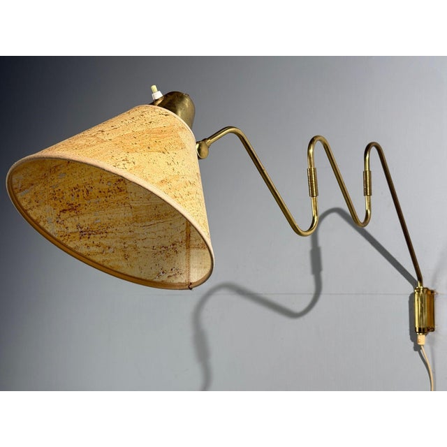 Danish Mid-Century Modern, Large Articulating Wall Light or Sconce, Brass, Denmark, 1960s A large patinated brass...