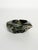 An elegant bowl carved from a block of natural stone, dating from the 1950s. The upper part is carefully polished,...