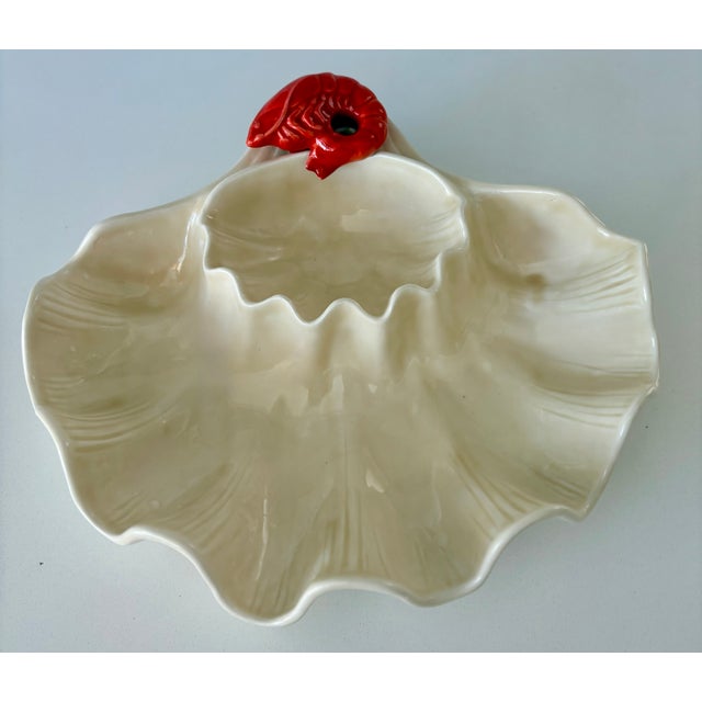 This vintage ceramic serving dish is from California Pottery maker Metlox. circa 1950-1960's. The base is in the shape of...